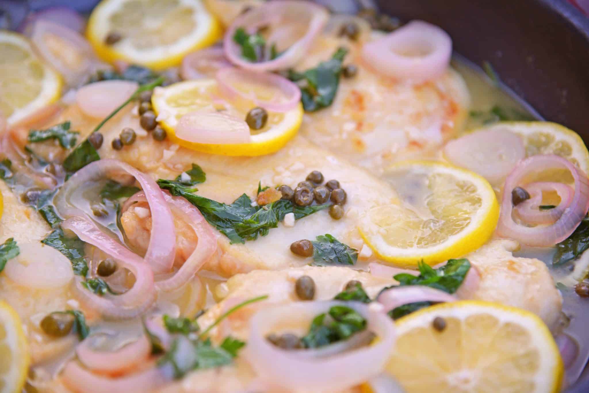 Classic Chicken Piccata is an easy Italian recipe that comes together in less than 3o minutes and explodes with flavors of lemon, caper and shallot. Delicious!  #chickenpiccata #easyitalianrecipes www.savoryexperiments.com 