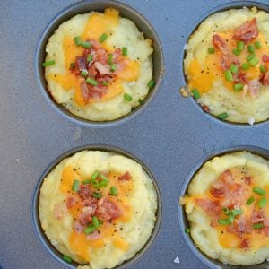 Loaded Mashed Potato Cups are the best way to use leftover mashed potatoes. Mixed with cheese, eggs and a few other ingredients, you load them into a muffin tin and poof, you've got finger food mashed potatoes! #mashedpotatoes #mashedpotatocups www.savoryexperiments.com