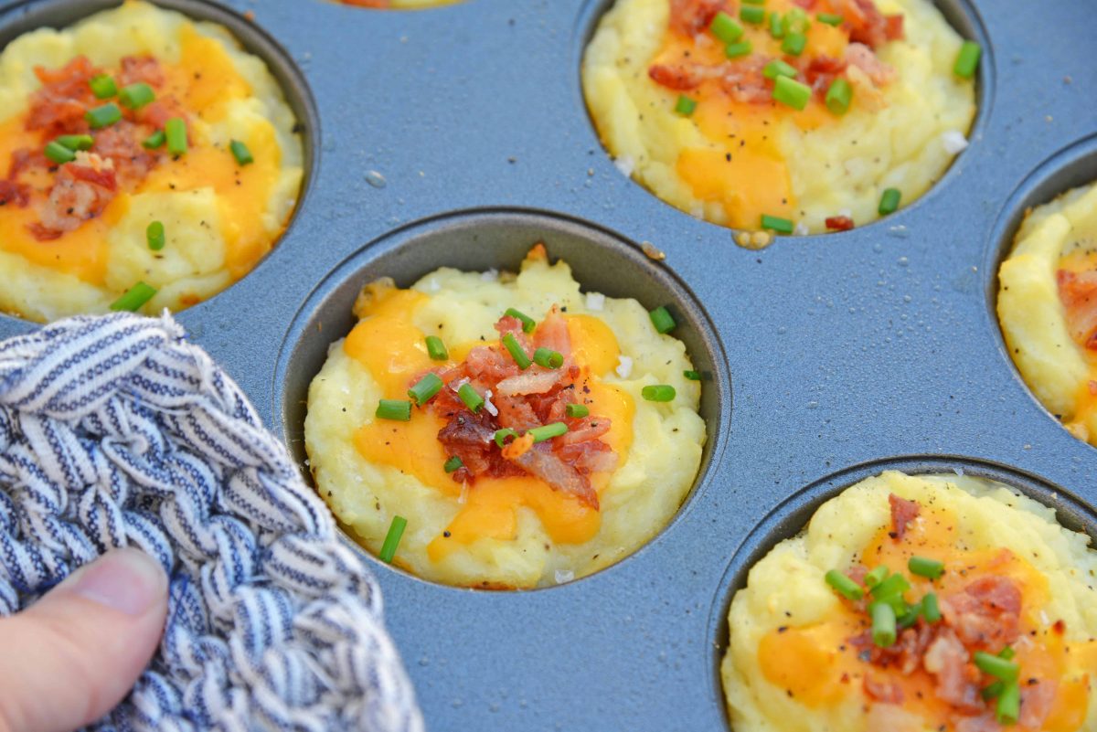 Loaded Mashed Potato Cups are the best way to use leftover mashed potatoes. Mixed with cheese, eggs and a few other ingredients, you load them into a muffin tin and poof, you've got finger food mashed potatoes! #mashedpotatoes #mashedpotatocups www.savoryexperiments.com