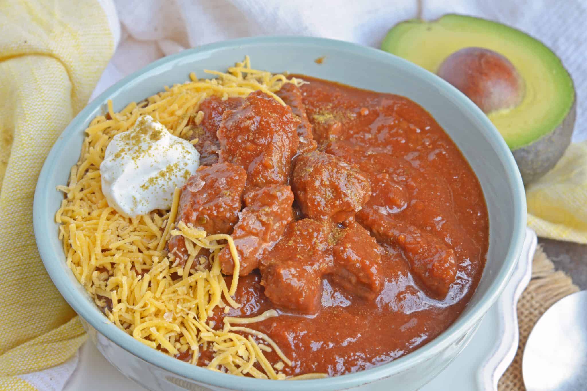 Red Beef Chili uses chunks of steak and simmers them to tender perfection in a chili tomato sauce. Serve over rice, noodles or as a stew. #bestchilirecipe #bobbyflay #redbeefchili www.savoryexperiments.com