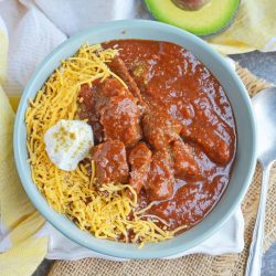 Red Beef Chili uses chunks of steak and simmers them to tender perfection in a chili tomato sauce. Serve over rice, noodles or as a stew. #bestchilirecipe #bobbyflay #redbeefchili www.savoryexperiments.com