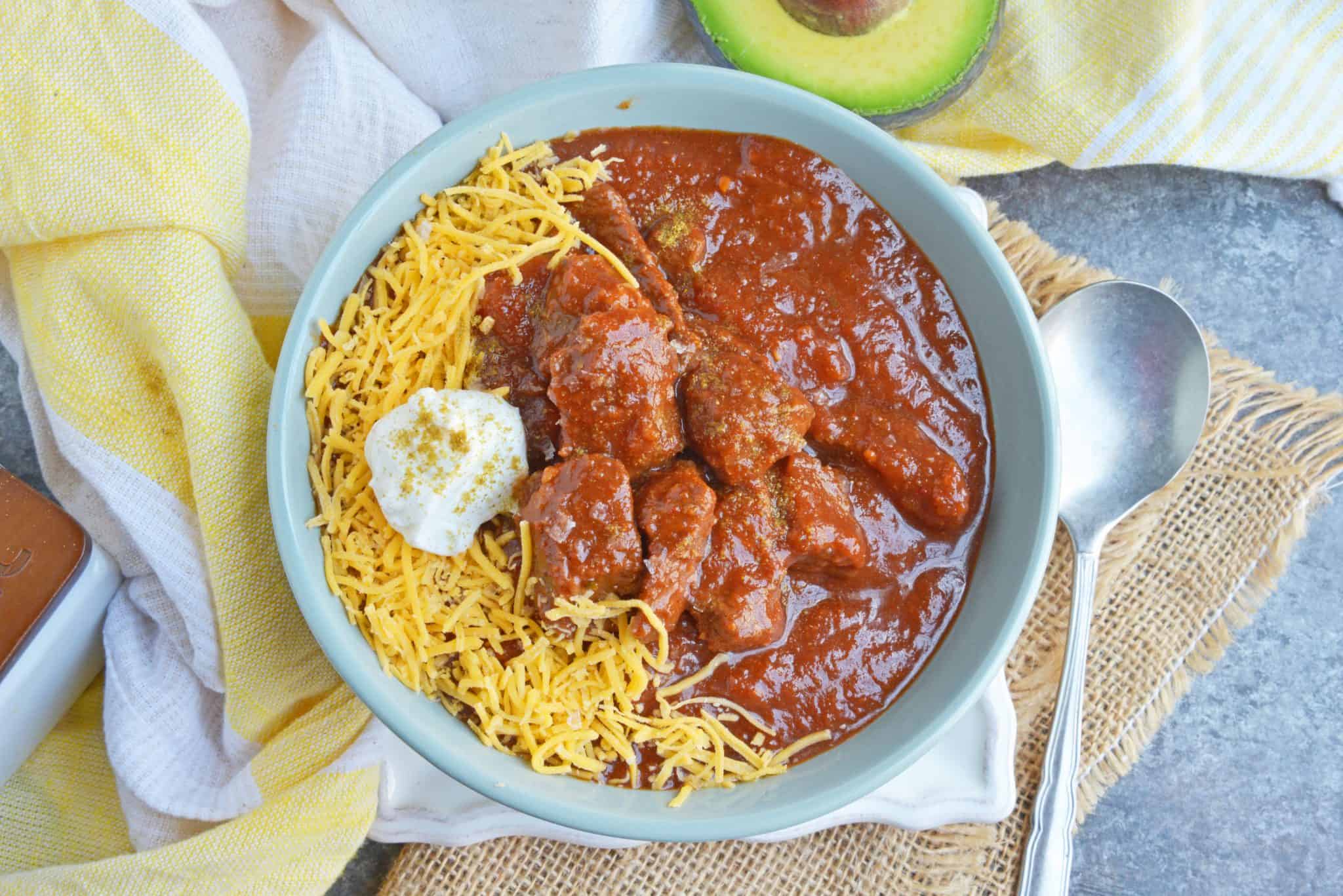 Red Beef Chili uses chunks of steak and simmers them to tender perfection in a chili tomato sauce. Serve over rice, noodles or as a stew. #bestchilirecipe #bobbyflay #redbeefchili www.savoryexperiments.com