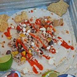 Slow Cooker Chicken Tacos only take 10 minutes to make in the crock pot! Just set it and forget it for a delicious dinner! #shreddedchickentacos #chickenstreettacos #softtacos www.savoryexperiments.com