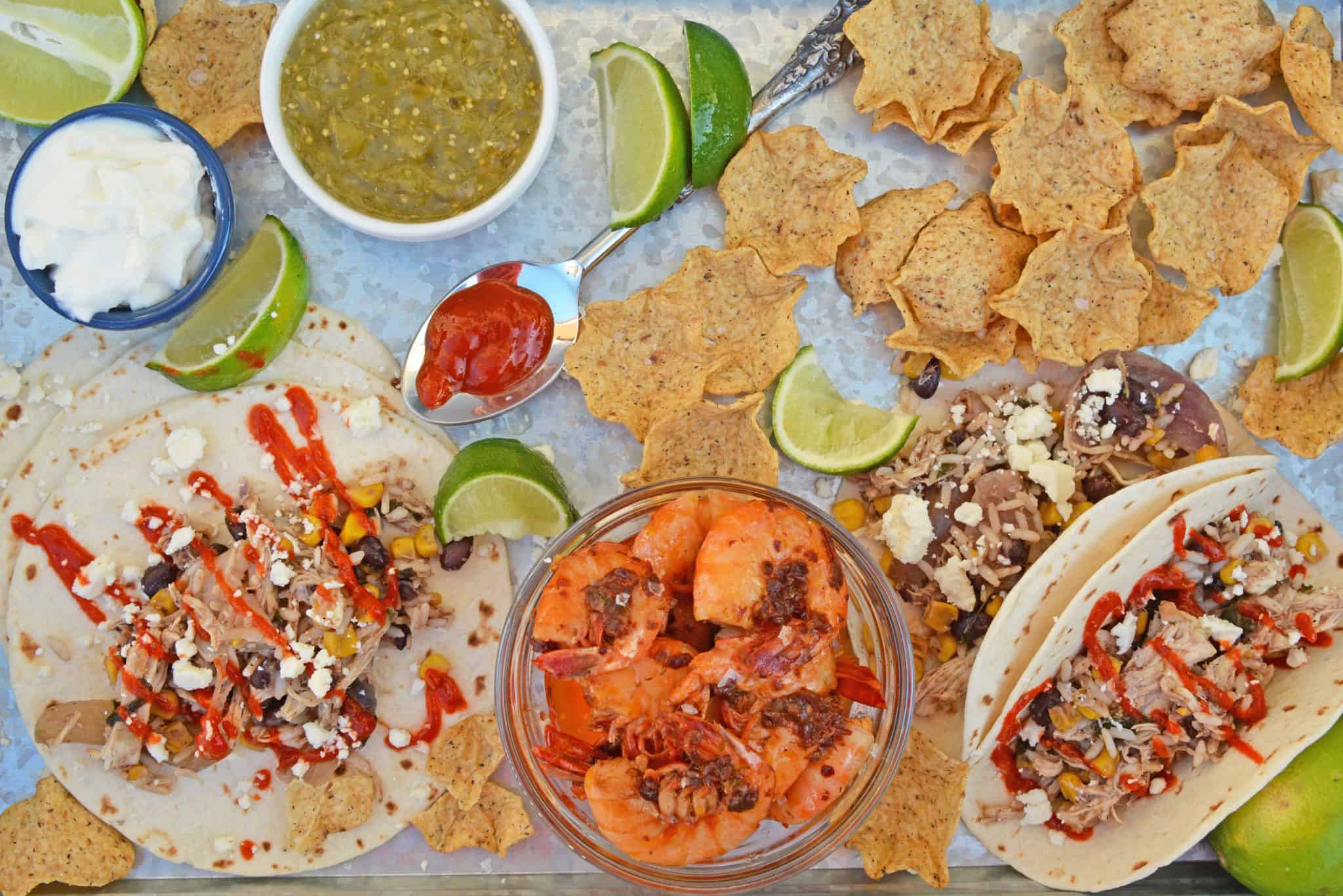 Slow Cooker Chicken Tacos only take 10 minutes to make in the crock pot! Just set it and forget it for a delicious dinner! #shreddedchickentacos #chickenstreettacos #softtacos www.savoryexperiments.com