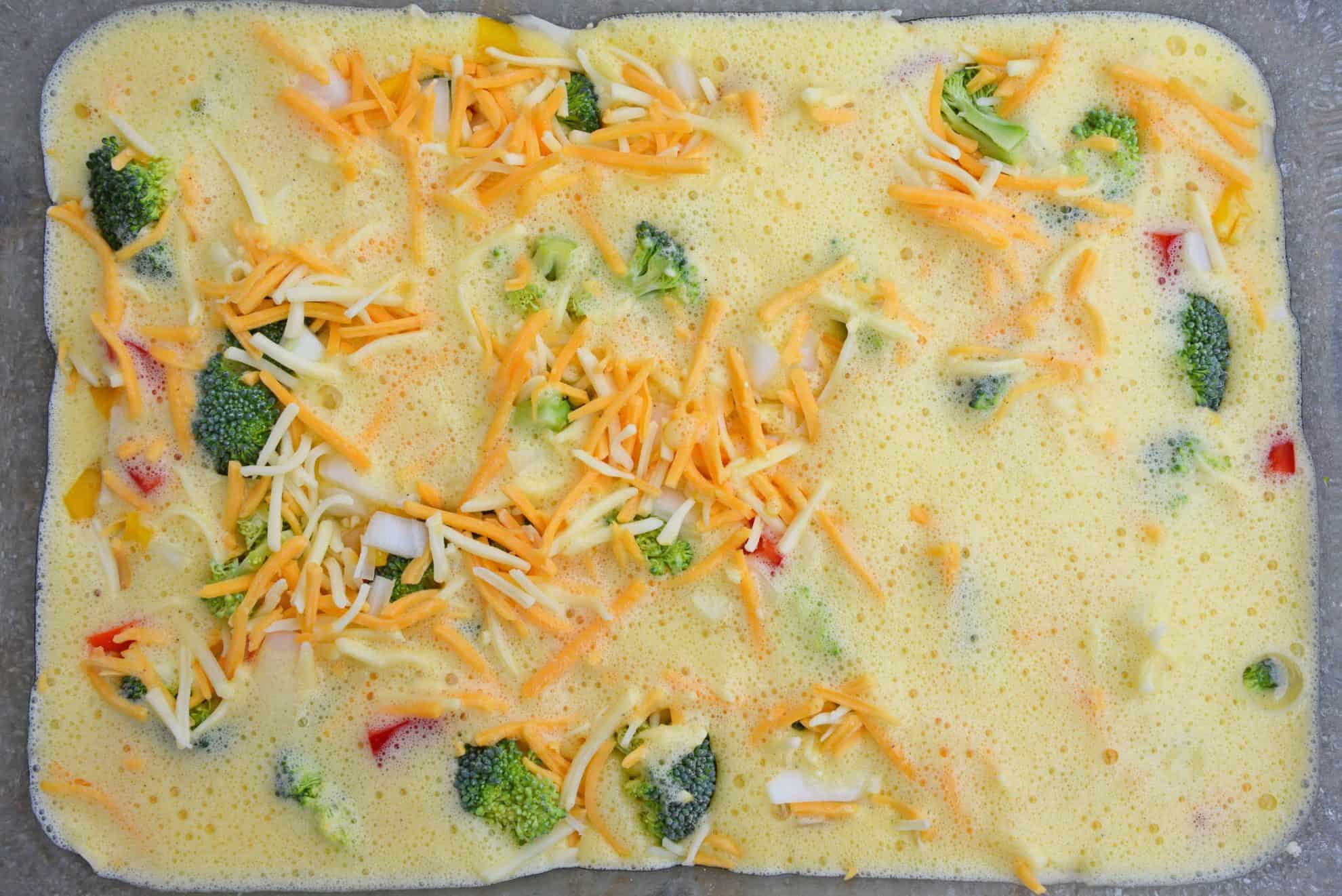 Cheesy Vegetable Breakfast Casserole uses fluffy eggs with broccoli, bell pepper, onion and cheese to make a delightful breakfast that is perfect for feeding a crowd! #vegetablecasserole #breakfastcasserole www.savoryexperiments.com 