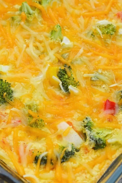 Cheesy Vegetable Breakfast Casserole uses fluffy eggs with broccoli, bell pepper, onion and cheese to make a delightful breakfast that is perfect for feeding a crowd! #vegetablecasserole #breakfastcasserole www.savoryexperiments.com