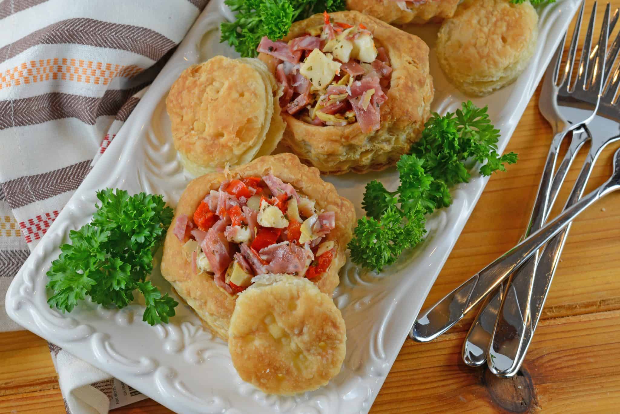 Antipasto Salad Cups are made of chopped salami, prosciutto, sopressata, mozzarella cheese, peppadews and artichokes. The best way to eat salad with your fingers!