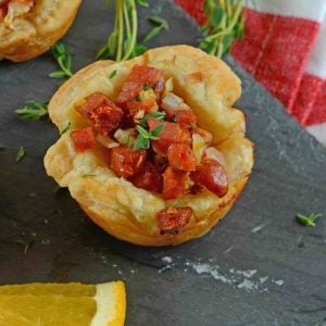 Citrus Sausage Cups are an easy appetizer using smoky andouille sausage, orange zest, sweet onion and fresh thyme in a puff pastry cup. #puffpastryappetizers #puffpastrycups www.savoryexperiments.com