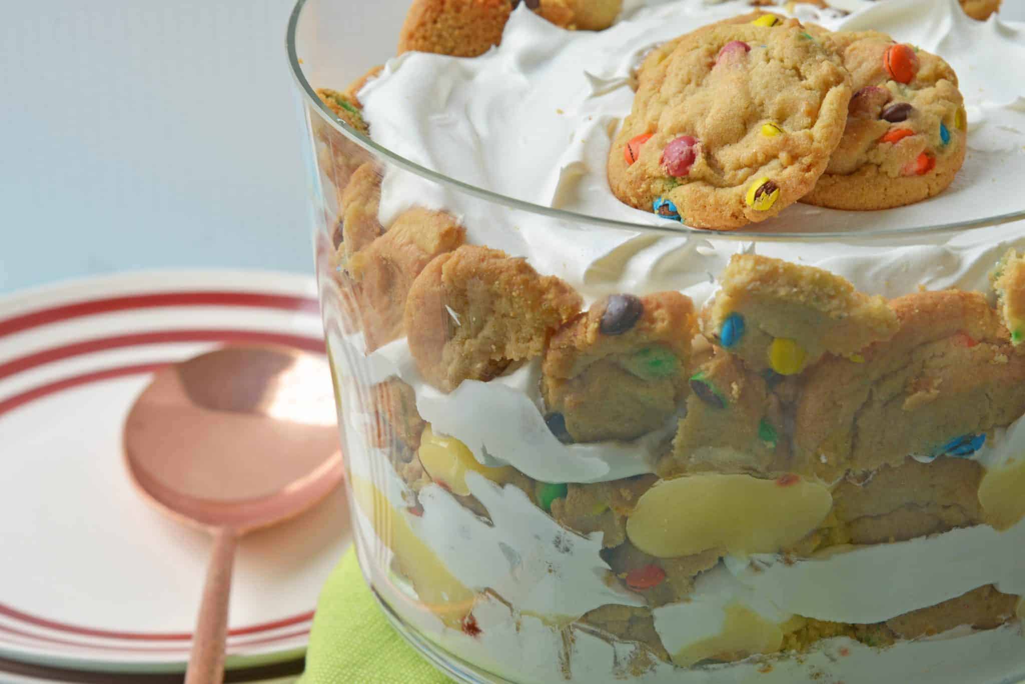 This Cookie Trifle recipe is a super easy trifle recipe that only uses 3 ingredients! Chocolate and butterscotch chip cookies, layered with vanilla custard and whipped cream! #cookiebomb #cookietrifle #triflerecipe www.savoryexperiments.com