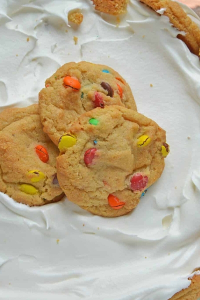 This Cookie Trifle recipe is a super easy trifle recipe that only uses 3 ingredients! Chocolate and butterscotch chip cookies, layered with vanilla custard and whipped cream! #cookiebomb #cookietrifle #triflerecipe www.savoryexperiments.com