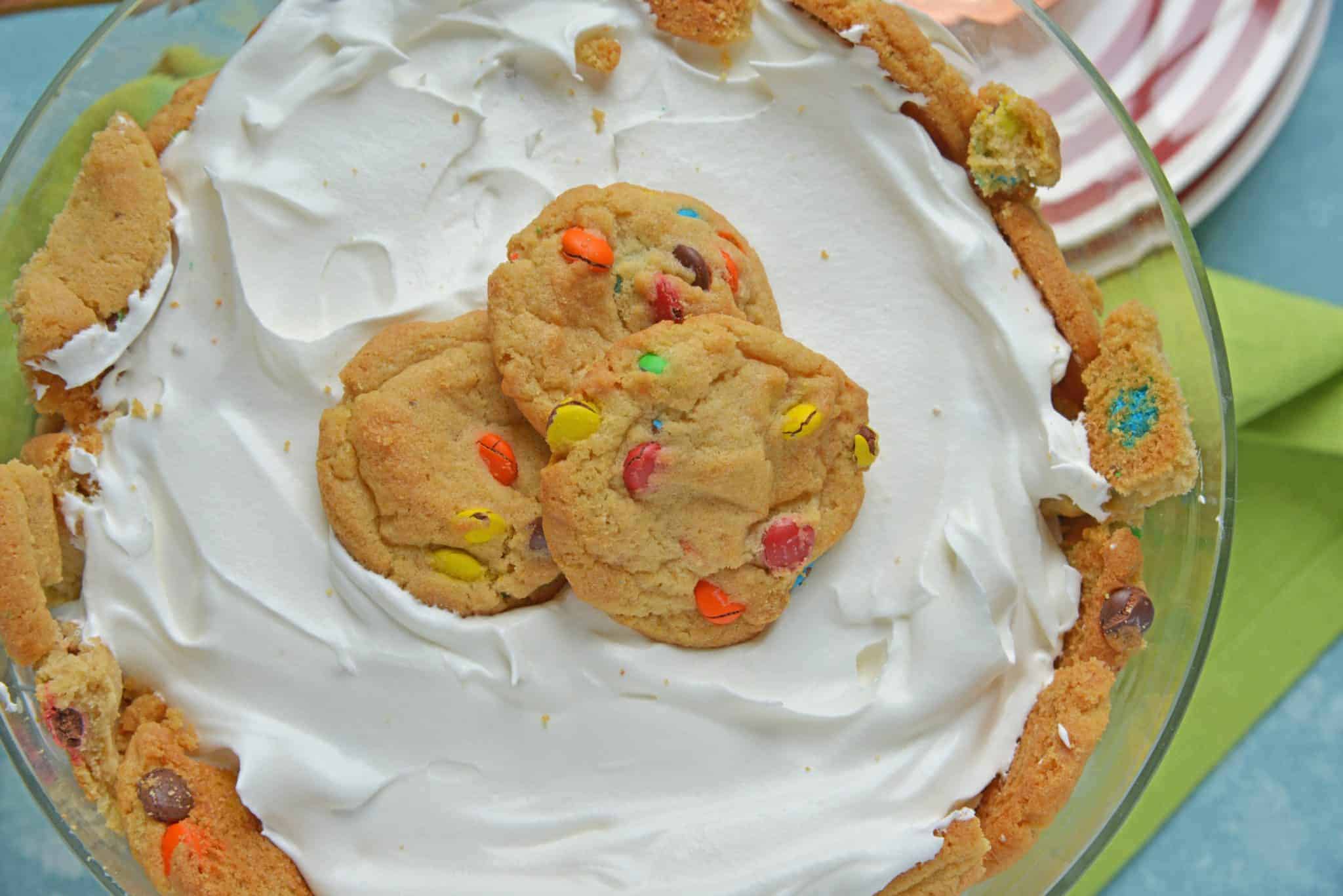 This Cookie Trifle recipe is a super easy trifle recipe that only uses 3 ingredients! Chocolate and butterscotch chip cookies, layered with vanilla custard and whipped cream! #cookiebomb #cookietrifle #triflerecipe www.savoryexperiments.com