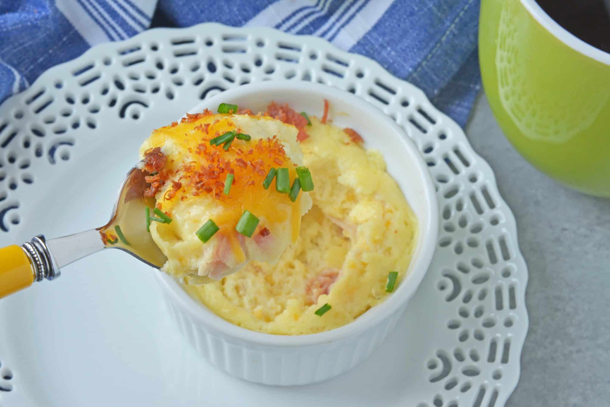 This Ham and Cheese Egg Soufflé recipe is perfect for breakfast or brunch, and great for a crowd! Made up of eggs, ham, cheddar cheese, bacon, and chives! #eggsoufflé #cheesesoufflé #soufflérecipe www.savoryexperiments.com