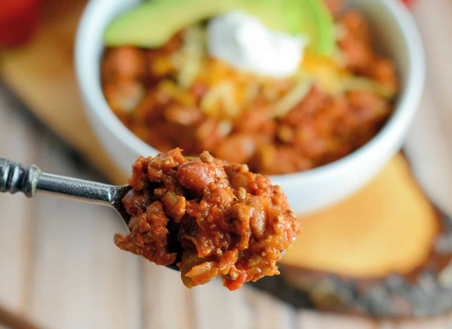 This Simple Chili only takes 30 minutes to throw together and will leave you wanting more. Lean beef, a blend of beans and spices, plus tomatoes and peppers make this packed with healthy ingredients. #simplechili #homemadechili #easychilirecipe www.savoryexperiments.com