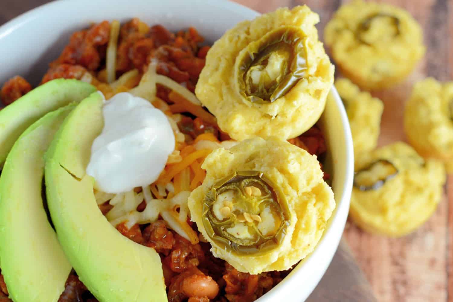 This Simple Chili only takes 30 minutes to throw together and will leave you wanting more. Lean beef, a blend of beans and spices, plus tomatoes and peppers make this packed with healthy ingredients. #simplechili #homemadechili #easychilirecipe www.savoryexperiments.com
