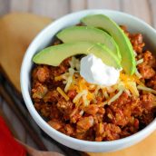 This Simple Chili only takes 30 minutes to throw together and will leave you wanting more. Lean beef, a blend of beans and spices, plus tomatoes and peppers make this packed with healthy ingredients. #simplechili #homemadechili #easychilirecipe www.savoryexperiments.com