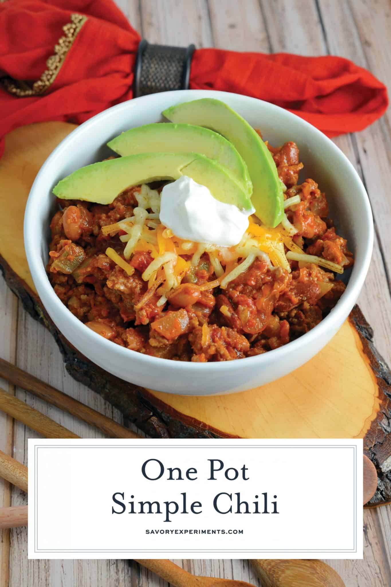 This Simple Chili only takes 30 minutes to throw together and will leave you wanting more. Lean beef, a blend of beans and spices, plus tomatoes and peppers make this packed with healthy ingredients. #simplechili #homemadechili #easychilirecipe www.savoryexperiments.com