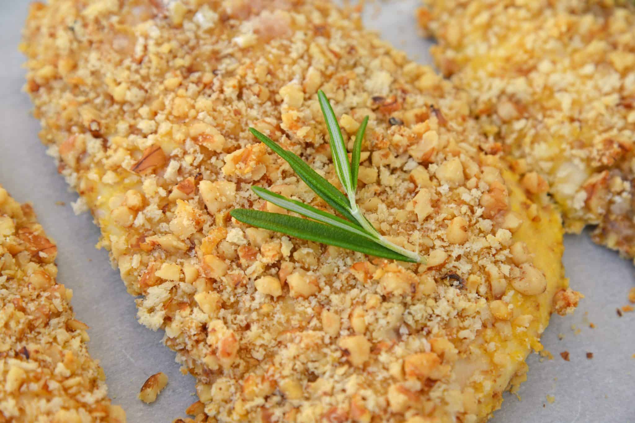Walnut Crusted Chicken is a deliciously healthy, crunchy chicken with a cool dipping sauce! Made with chopped walnuts, panko bread crumbs, and fresh rosemary! #walnutcrustedchicken #rosemarychicken www.savoryexperiments.com