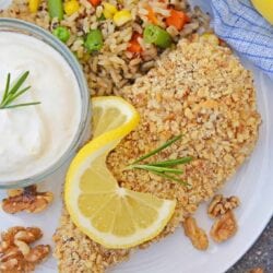 Walnut Crusted Chicken is a deliciously healthy, crunchy chicken with a cool dipping sauce! Made with chopped walnuts, panko bread crumbs, and fresh rosemary! #walnutcrustedchicken #rosemarychicken www.savoryexperiments.com