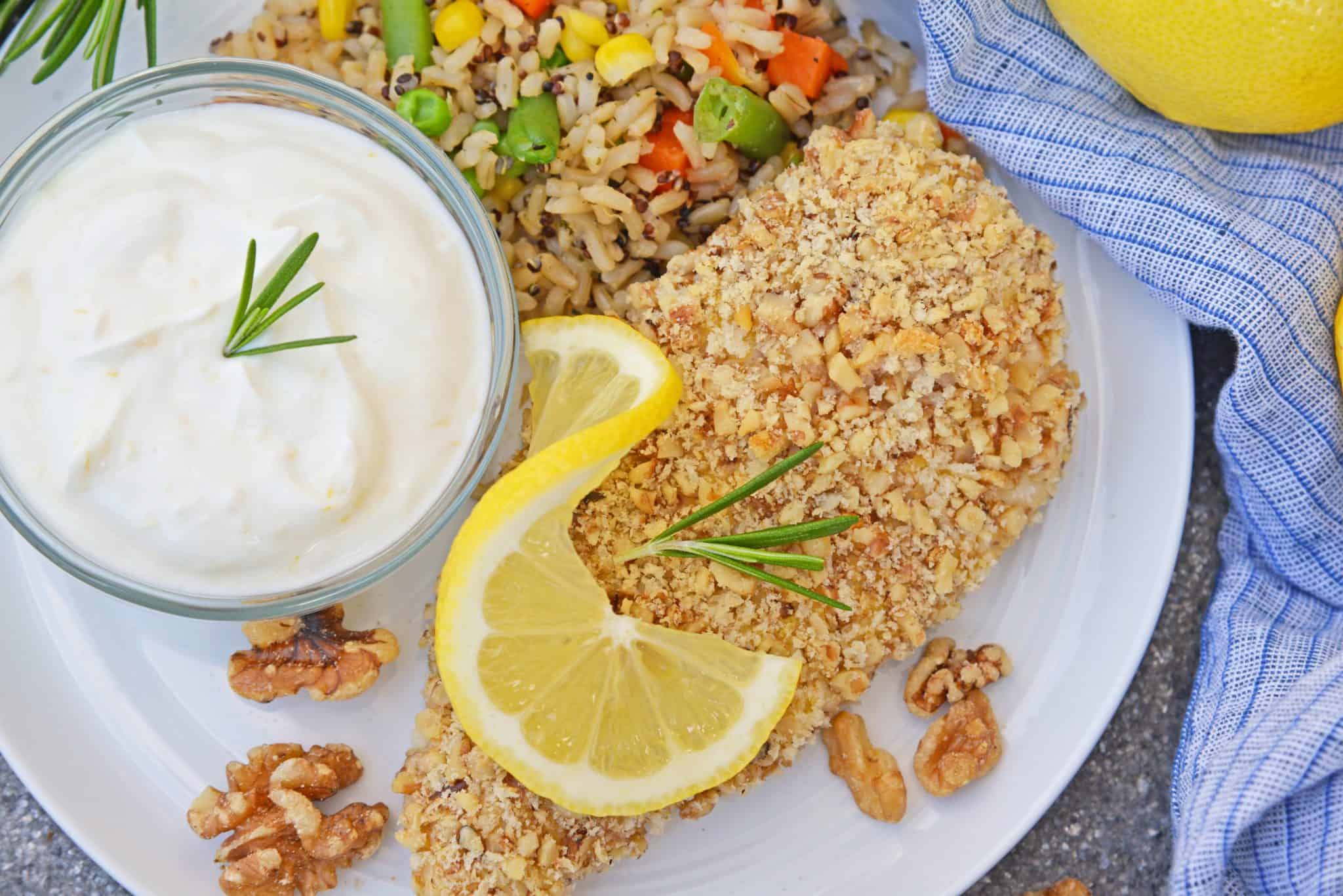 Walnut Crusted Chicken is a deliciously healthy, crunchy chicken with a cool dipping sauce! Made with chopped walnuts, panko bread crumbs, and fresh rosemary! #walnutcrustedchicken #rosemarychicken www.savoryexperiments.com