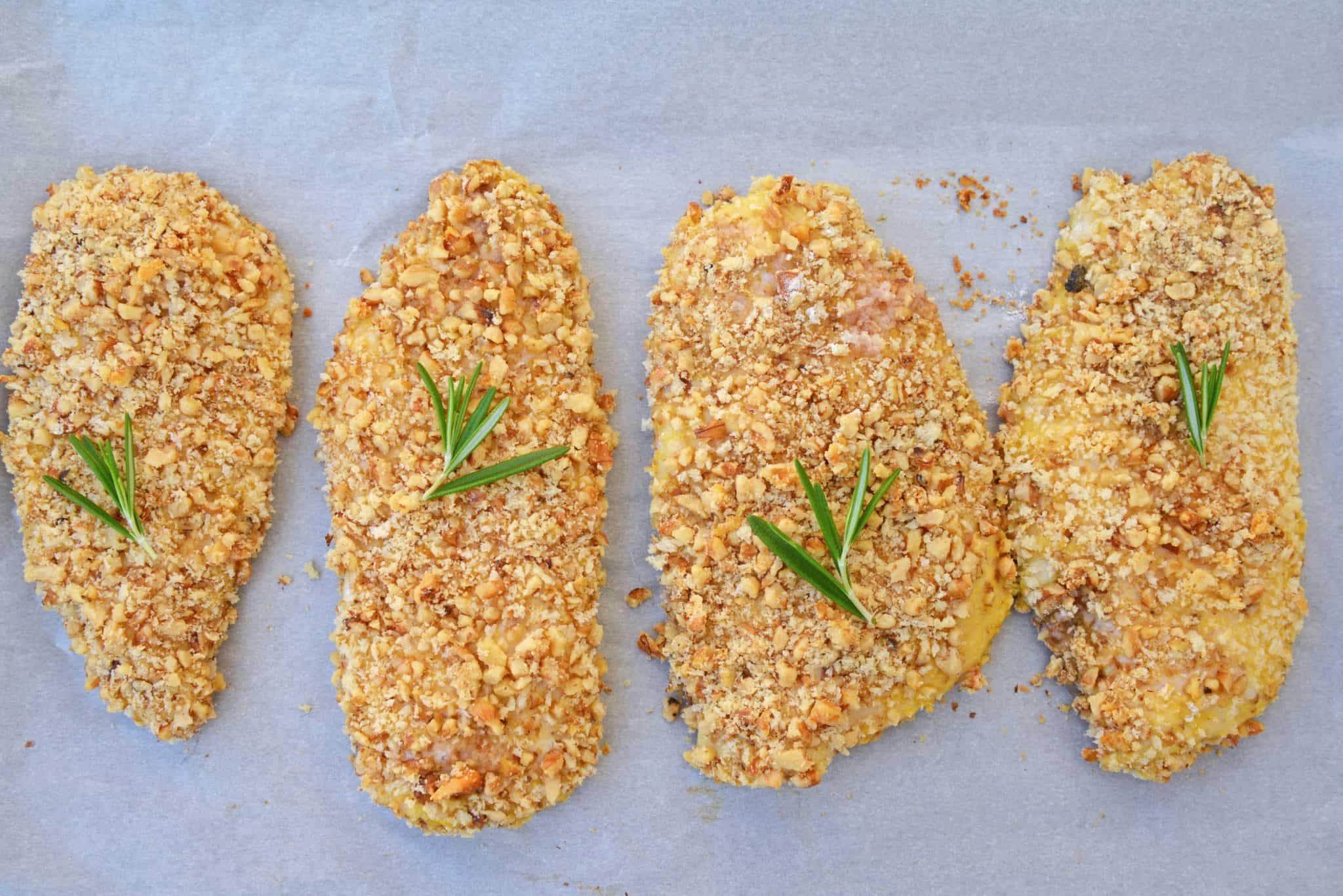 Walnut Crusted Chicken is a deliciously healthy, crunchy chicken with a cool dipping sauce! Made with chopped walnuts, panko bread crumbs, and fresh rosemary! #walnutcrustedchicken #rosemarychicken www.savoryexperiments.com