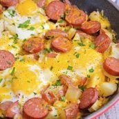 Sausage and Egg Skillet is a delicious breakfast skillet with andouille sausage, potato, eggs and gooey cheese. Ready in 30 minutes and perfect for special weekend brunch! #breakfastskilletrecipe #castironskilletrecipes www.savoryexperiments.com