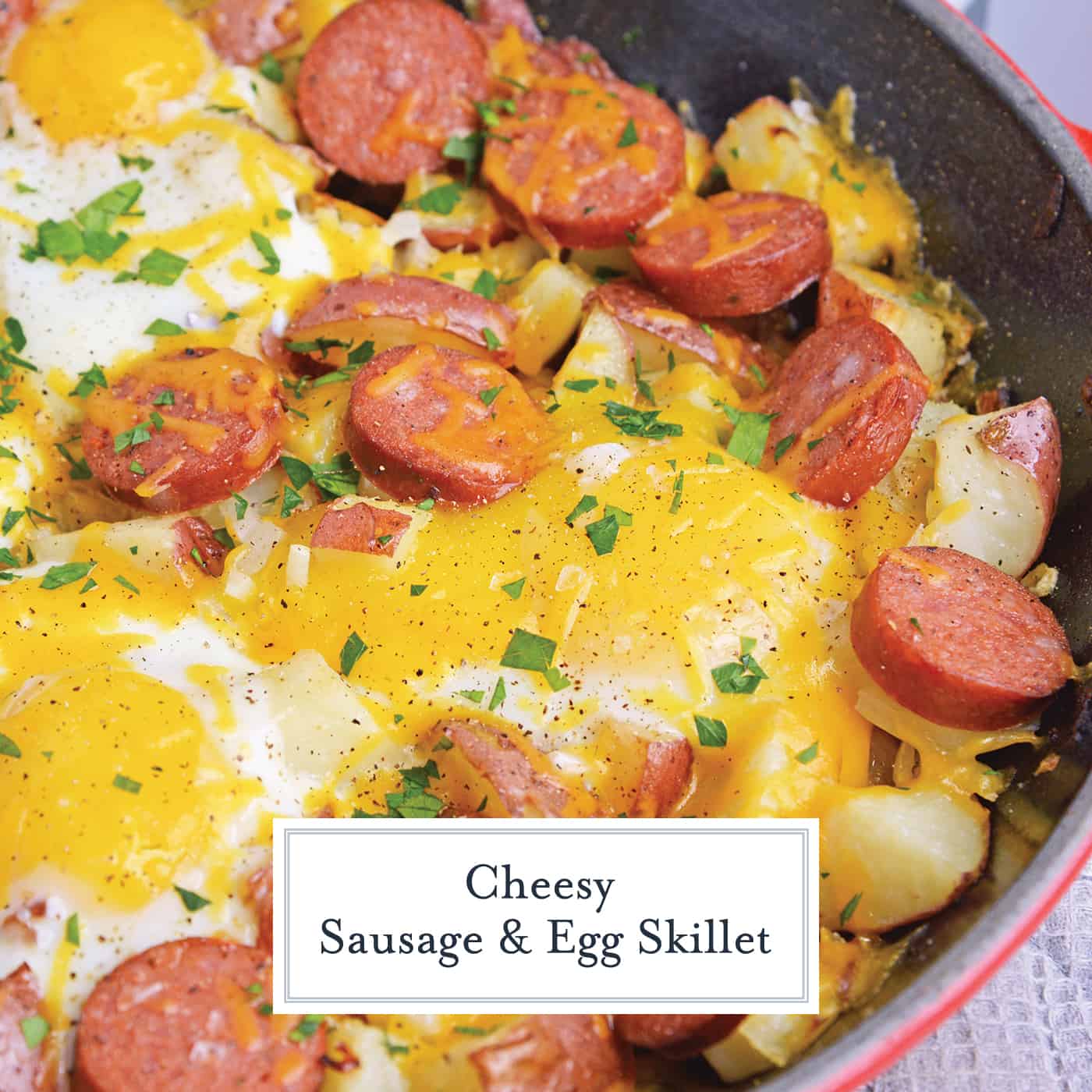 Sausage and Egg Skillet is a delicious breakfast skillet with andouille sausage, potato, eggs and gooey cheese. Ready in 30 minutes and perfect for special weekend brunch! #breakfastskilletrecipe #castironskilletrecipes www.savoryexperiments.com