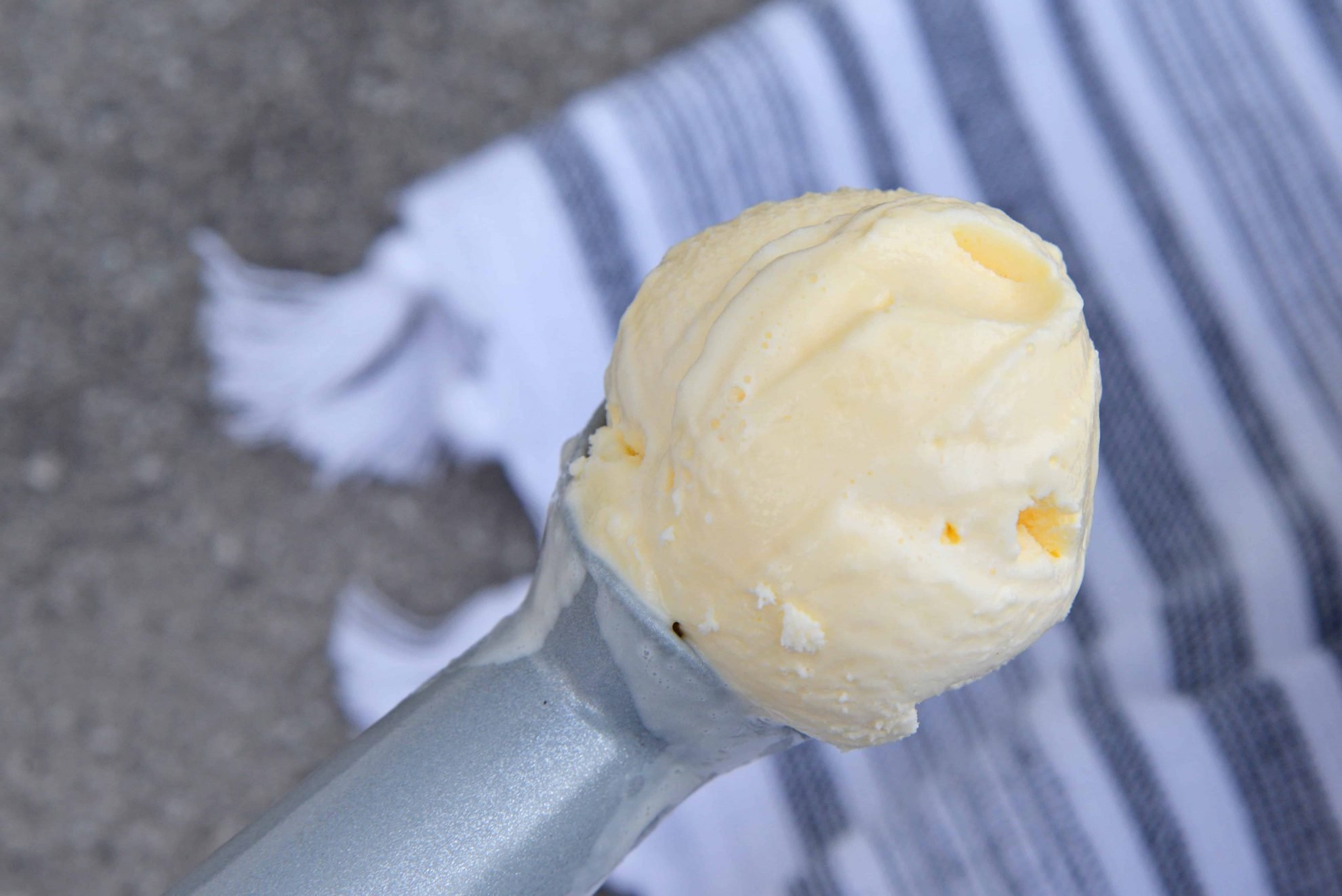 close up of butter ice cream in a scoop 