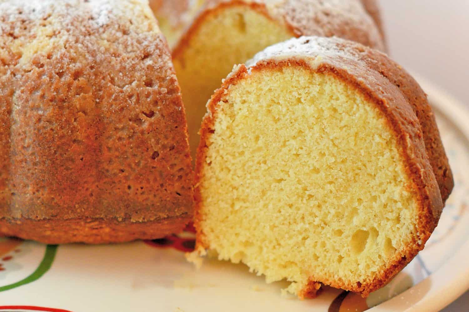 Cardamom Lemon Cake is a light cake and gently flavored. It pairs perfectly with tea, coffee or the grand finale to any meal. The perfect lemon bundt cake! #lemoncake #lemonbundtcake www.savoryexperiments.com