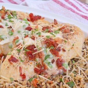 Creamy Garlic Chicken is an easy chicken recipe for dinner using a homemade cream sauce, parmesan cheese, bacon, peas and sun dried tomatoes. A chicken dinner idea ready in just 30 minutes.Ā #chickendinnerideas #chickenrecipesfordinner www.savoryexperiments.com