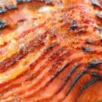 Peach and Riesling Baked Ham Recipe- Beautifully caramelized Baked Ham with Peach Brown Sugar Glaze. Perfect Easter dinner idea or make for Sunday supper. Feeds a crowd and it easy to make! www.savoryexperiments.com