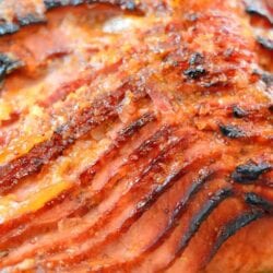 Peach and Riesling Baked Ham Recipe- Beautifully caramelized Baked Ham with Peach Brown Sugar Glaze. Perfect Easter dinner idea or make for Sunday supper. Feeds a crowd and it easy to make! www.savoryexperiments.com