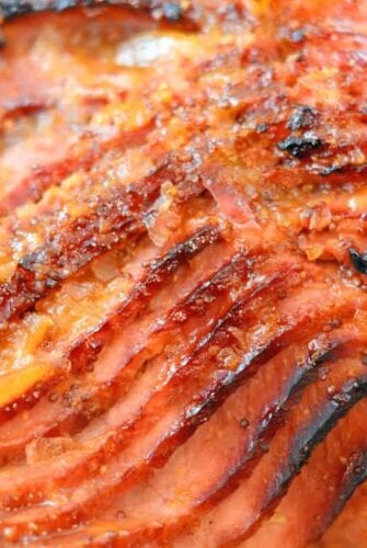 Peach and Riesling Baked Ham Recipe- Beautifully caramelized Baked Ham with Peach Brown Sugar Glaze. Perfect Easter dinner idea or make for Sunday supper. Feeds a crowd and it easy to make! www.savoryexperiments.com