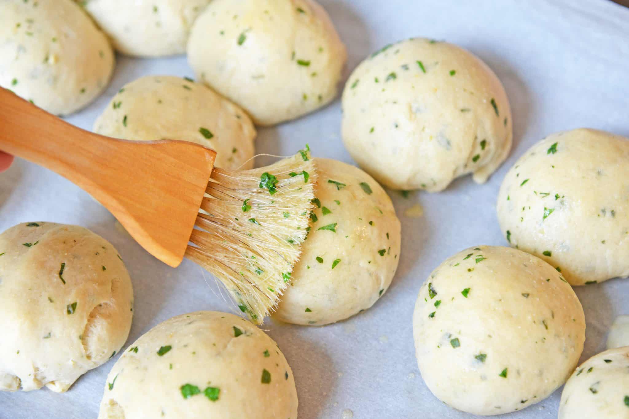 These Cheese Stuffed Garlic Rolls are delicious garlic and parsley rolls stuffed with gooey mozzarella cheese. Eat them plain or with a side of marinara. #cheesestuffedgarlicrolls #garlicrolls #mozzarella www.savoryexperiments.com