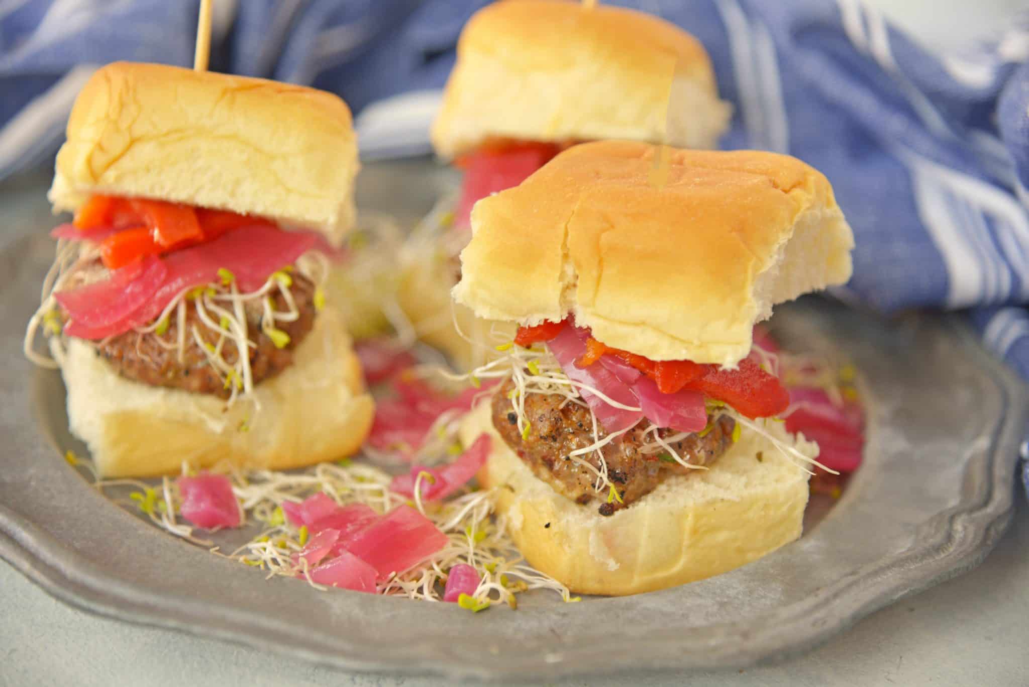 These Italian Sausage Sandwich Sliders are easy to prepare and even easier to eat. Featuring pork sausage and Hawaiian rolls, they are sure to impress.