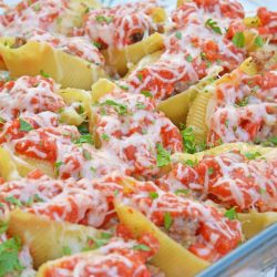 These Sausage and Peppers Stuffed Shells are a mashup of two fan favorites and are a fun way to spice up any weekday meal. They are guaranteed to wow! #sausageandpeppersstuffedshells #sausageandpeppers #stuffedshells www.savoryexperiments.com