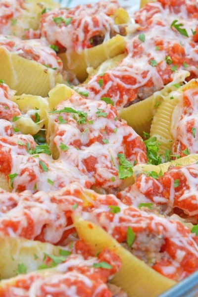 These Sausage and Peppers Stuffed Shells are a mashup of two fan favorites and are a fun way to spice up any weekday meal. They are guaranteed to wow! #sausageandpeppersstuffedshells #sausageandpeppers #stuffedshells www.savoryexperiments.com