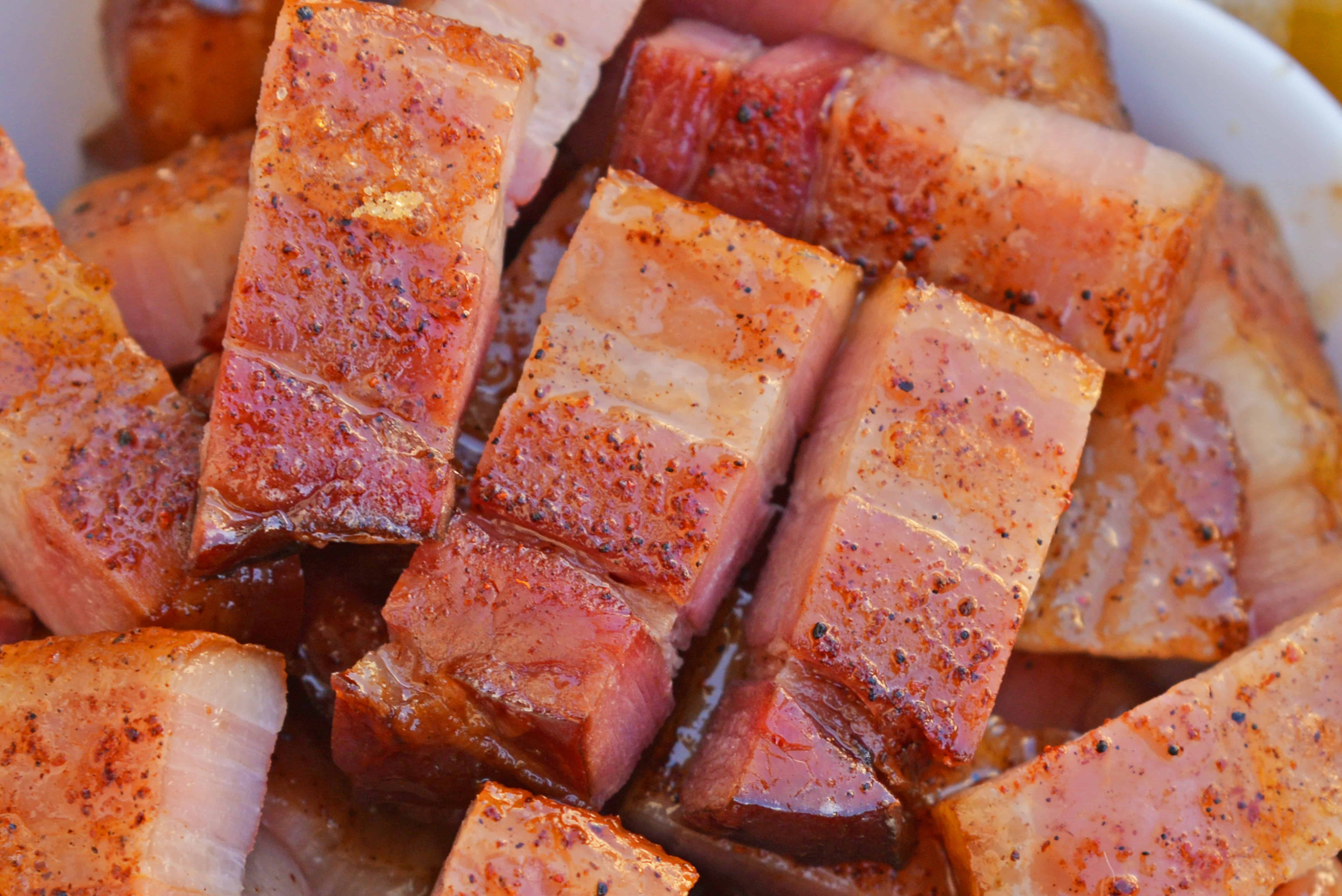 Candied bacon is the best sweet and salty snack with a kick. Serve as strips or bites, bacon is caramelized with brown sugar and and a touch of heat. #candiedbacon #pigcandy #brownsugarbacon www.savoryexperiments.com