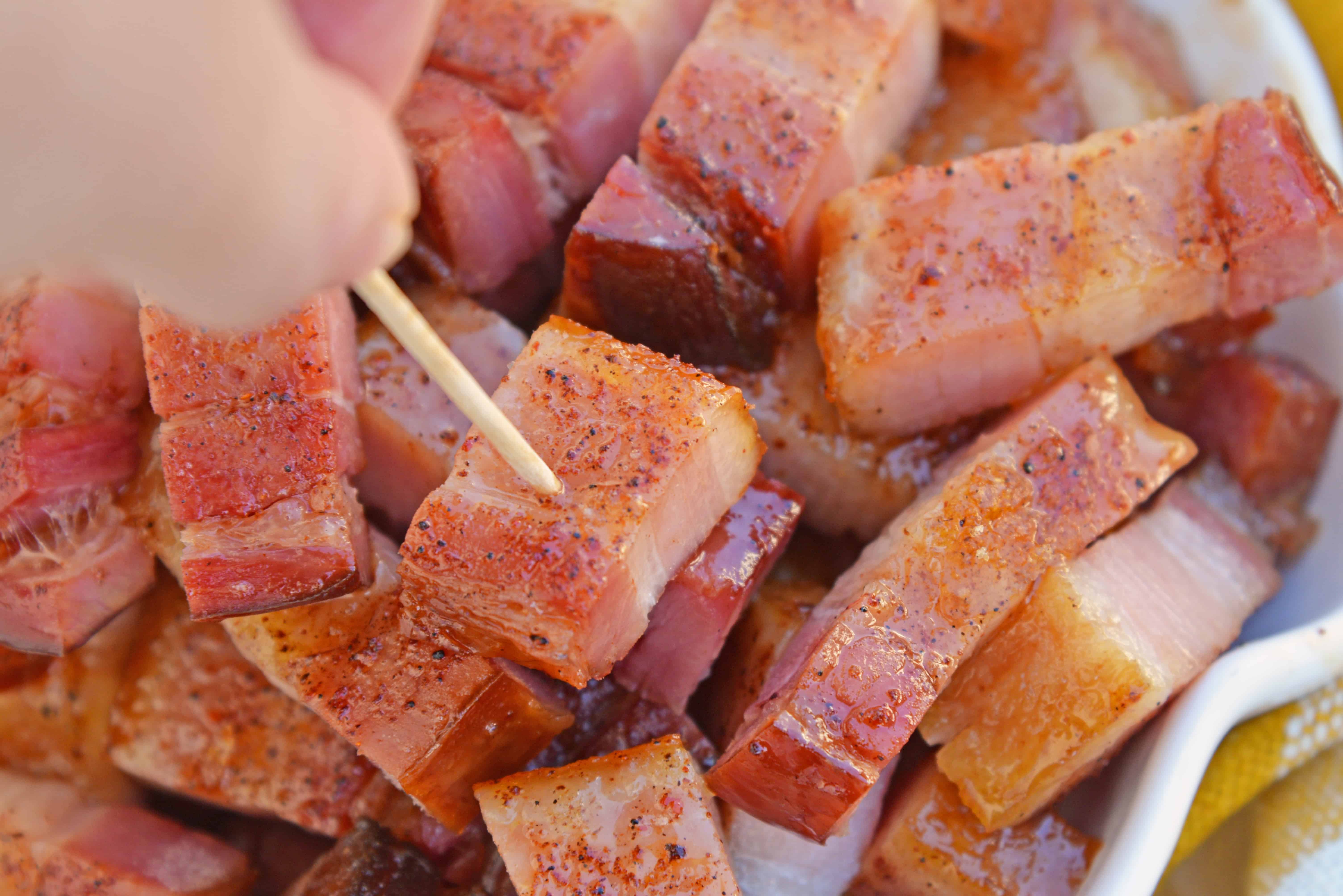 Candied bacon is the best sweet and salty snack with a kick. Serve as strips or bites, bacon is caramelized with brown sugar and and a touch of heat. #candiedbacon #pigcandy #brownsugarbacon www.savoryexperiments.com