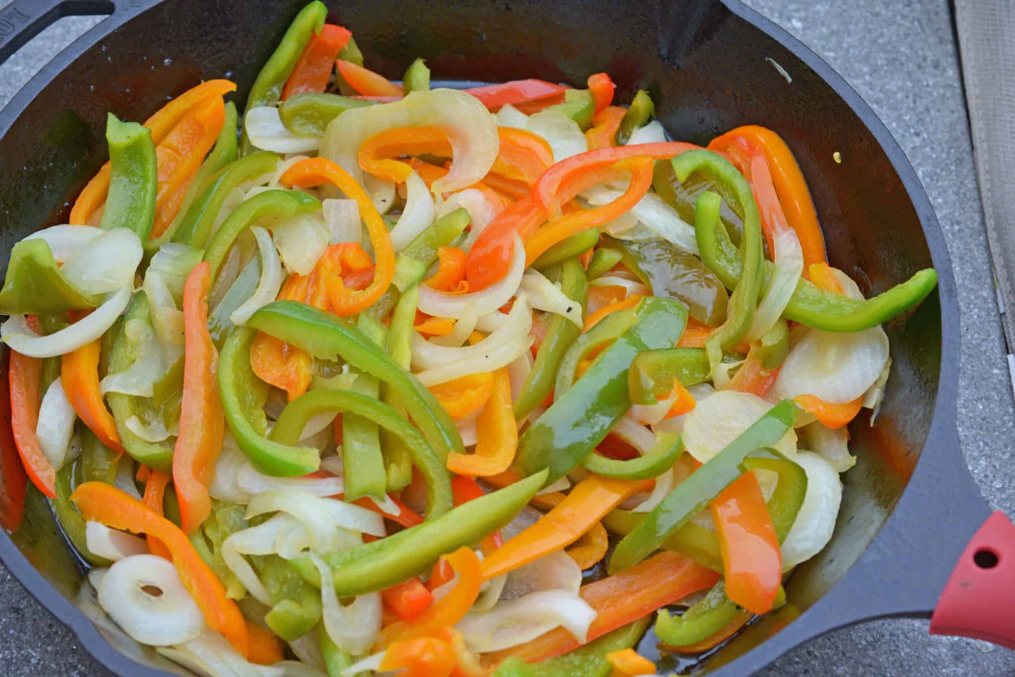 My Grilled Chicken Fajitas are a simple and healthy meal that you can have ready in under 30 minutes and make for the perfect weeknight meal.  #grilledchickenfajitas #fajitas #grilledchicken www.savoryexperiments.com