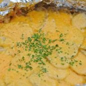 Slow Cooker Potatoes au Gratin are an amazing copycat recipe of Fleming's Steakhouse's potatoes.  Pop it in your slow cooker and reap the cheesy benefits. #slowcookerpotatoesaugratin #potatoesaugratin www.savoryexperiments.com