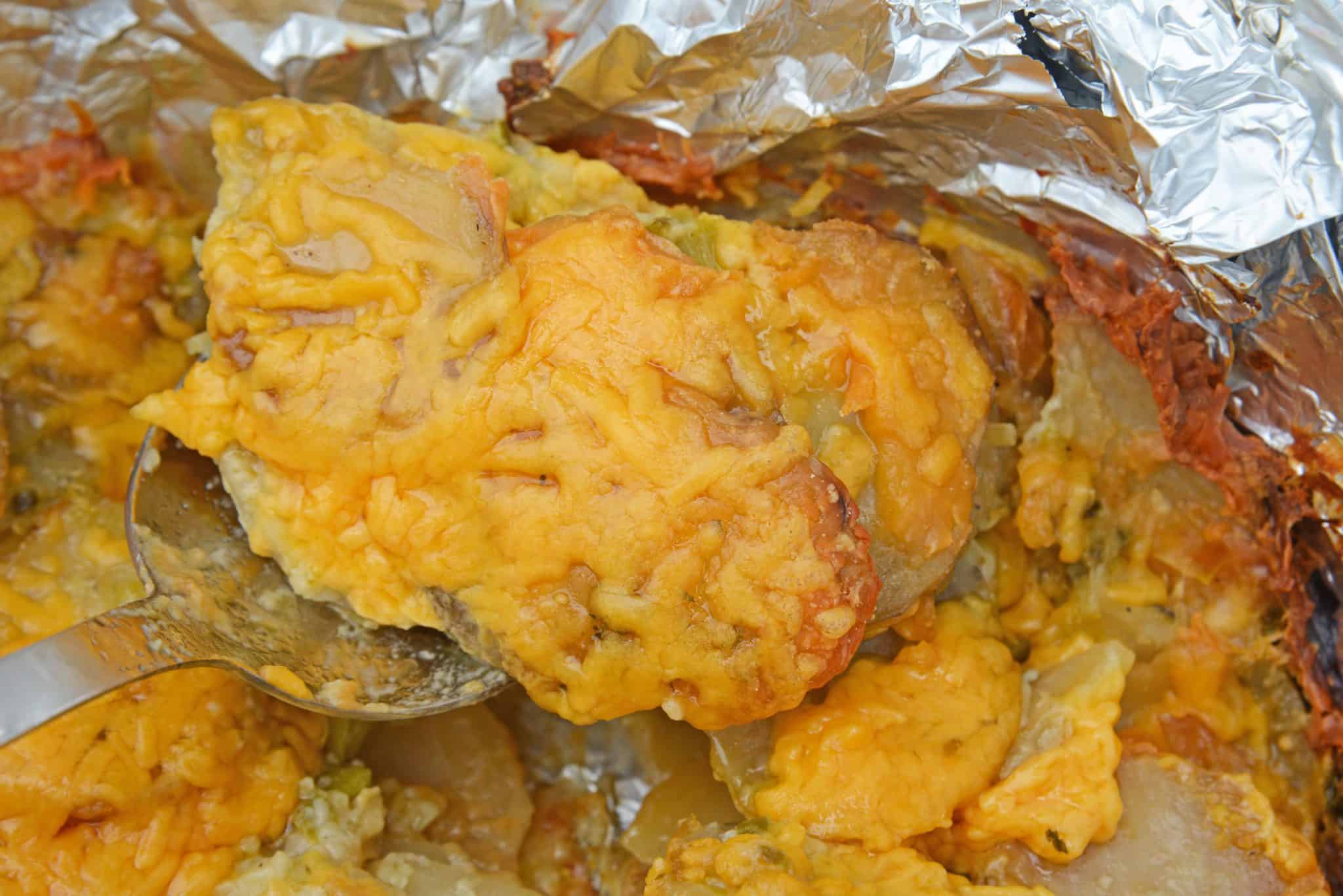 Slow Cooker Potatoes au Gratin are an amazing copycat recipe of Fleming's Steakhouse's potatoes.  Pop it in your slow cooker and reap the cheesy benefits. #slowcookerpotatoesaugratin #potatoesaugratin www.savoryexperiments.com