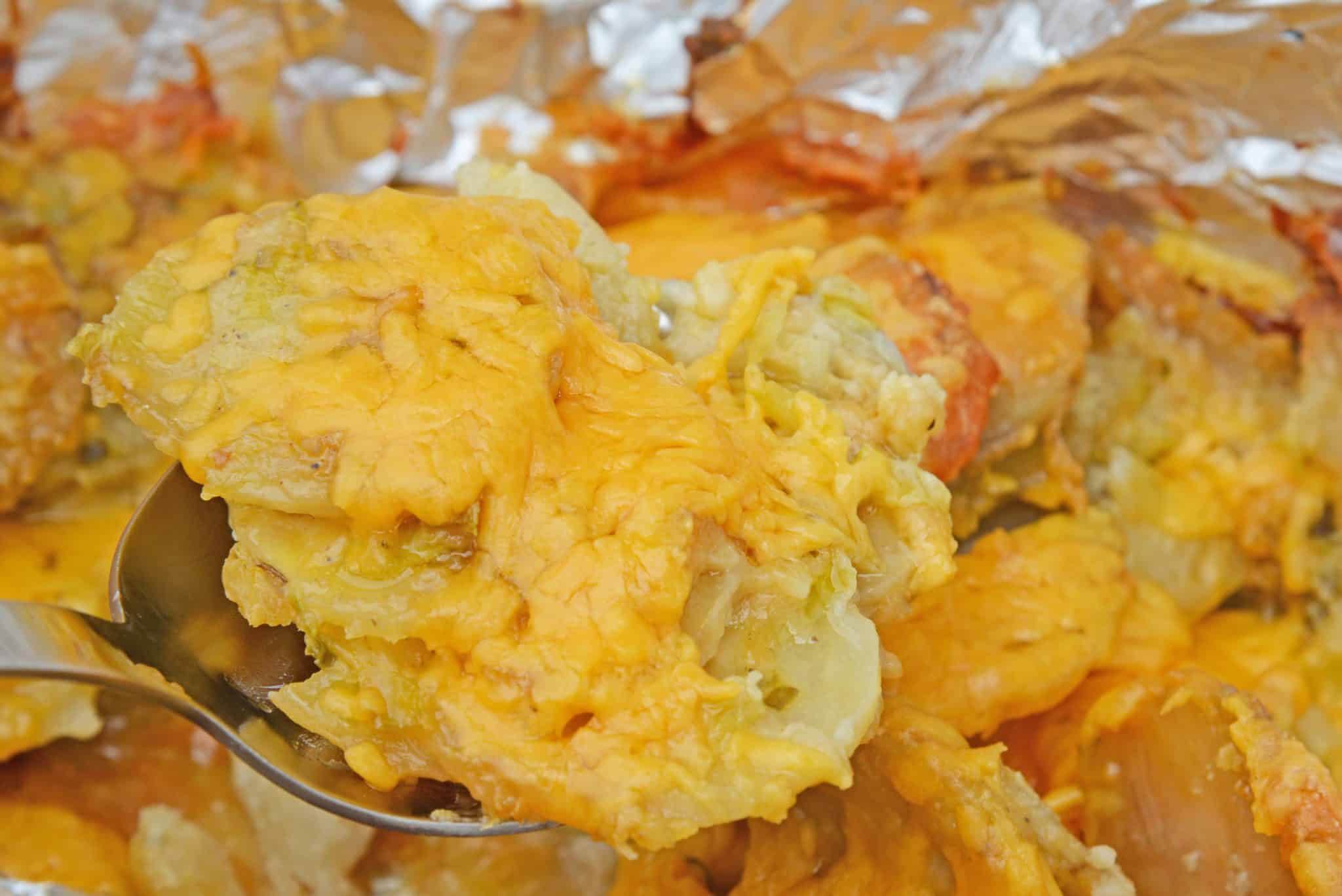 Slow Cooker Potatoes au Gratin are an amazing copycat recipe of Fleming's Steakhouse's potatoes.  Pop it in your slow cooker and reap the cheesy benefits. #slowcookerpotatoesaugratin #potatoesaugratin www.savoryexperiments.com