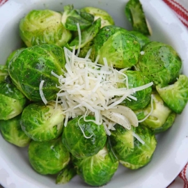 Garlic Butter Brussels Sprouts is an easy side dish that even sprout haters will love! Fresh brussel sprouts covered in butter, garlic, and topped with parmesan cheese. #brusselssproutsrecipes #garlicbutter www.savoryexperiments.com