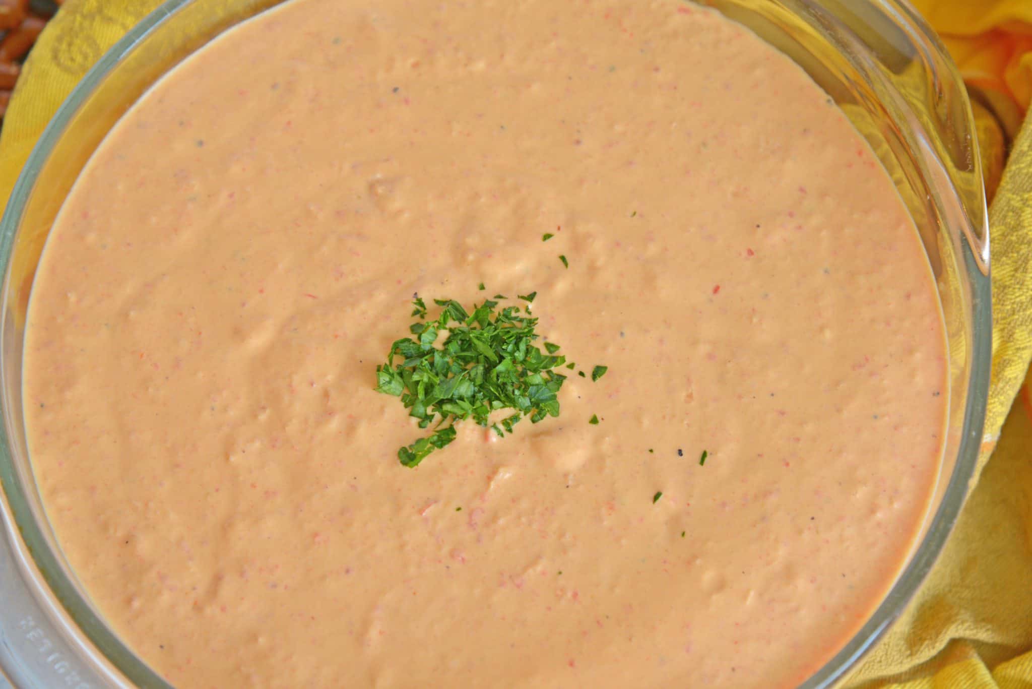 Roasted Red Pepper Dip is tangy, light, and irresistibly delicious. Served warm or cold, it is perfect for parties or an afternoon snack. #roastedredpepperdip #chipdip #roastedredpepper www.savoryexperiments.com