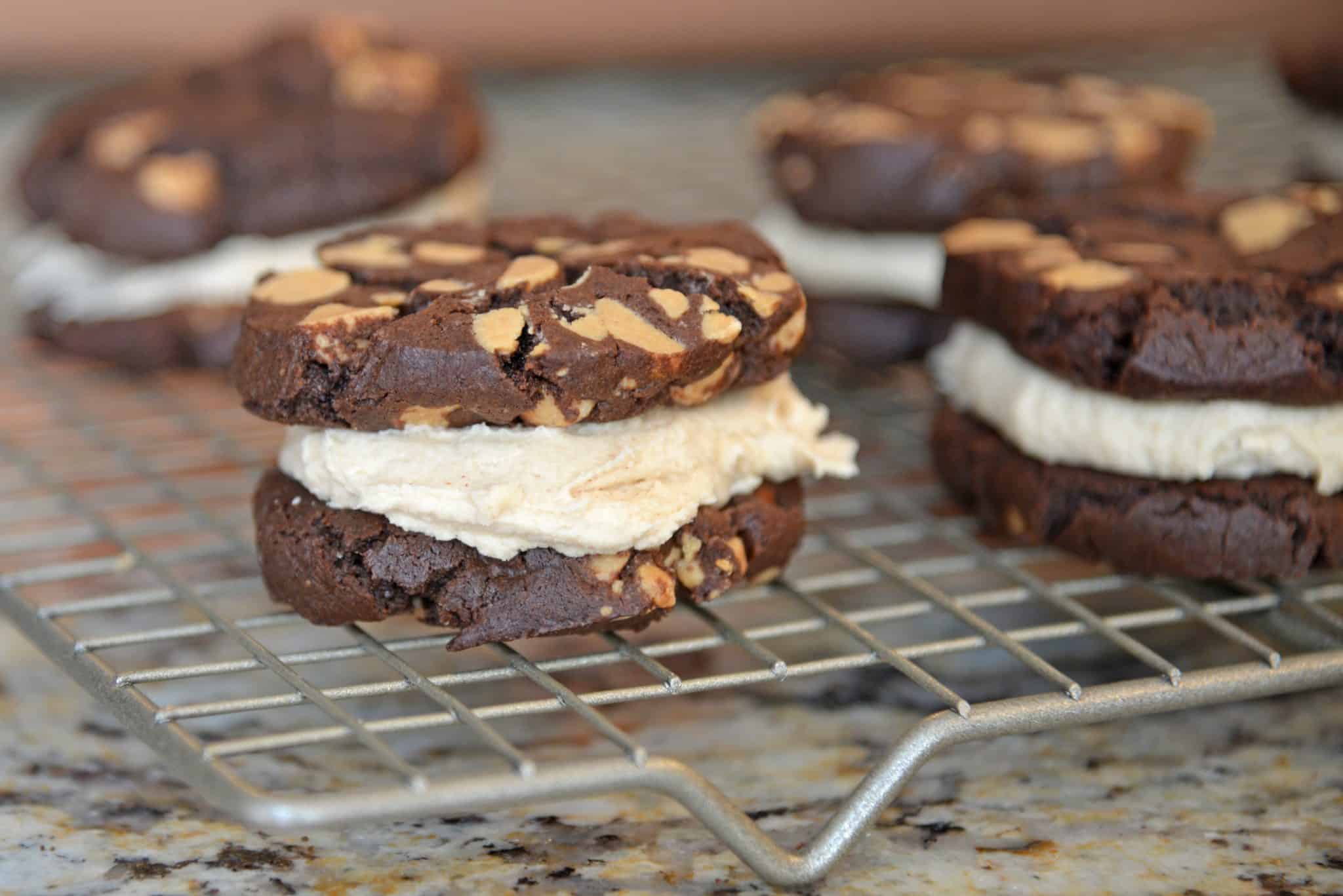 These Chocolate Peanut Butter Cookie Sandwiches are quite possibly the best cookie sandwich you will ever eat. Highly addictive: bake with caution! #chocolatepeanutbuttersandwichcookies #sandwichcookies #peanutbutter www.savoryexperiments.com