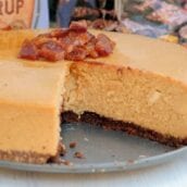 Candied Bacon Maple Cheesecake is made up of a maple cheesecake topped with candied bacon and a Salted Caramel Brownie Brittle ™ Crust! #cheesecakerecipe #easycheesecakerecipe www.savoryexperiments.com