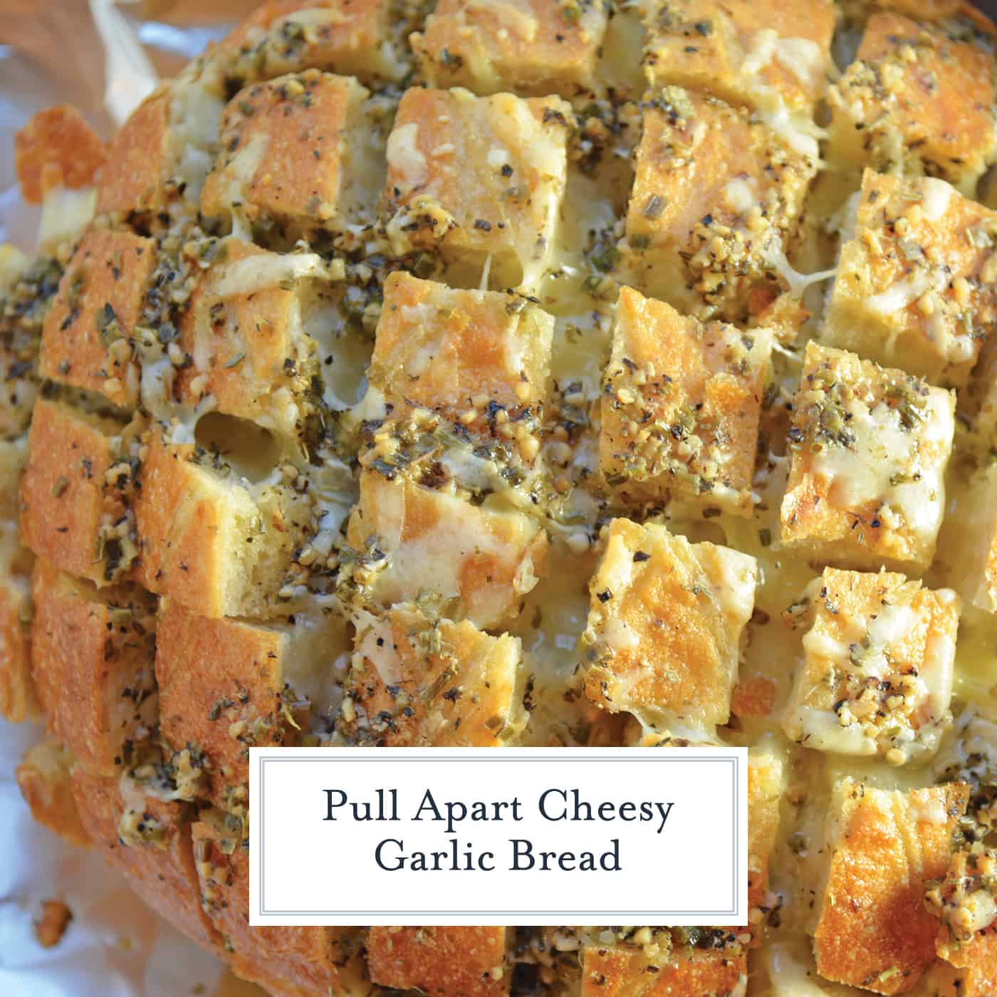 Pull Apart Cheesy Garlic Bread is a garlic bread recipe taken to new heights with cheese. It will be your new favorite go-to side. #pullapartcheesygarlicbread #garlicbread #pullapartbread www.savoryexperiments.com