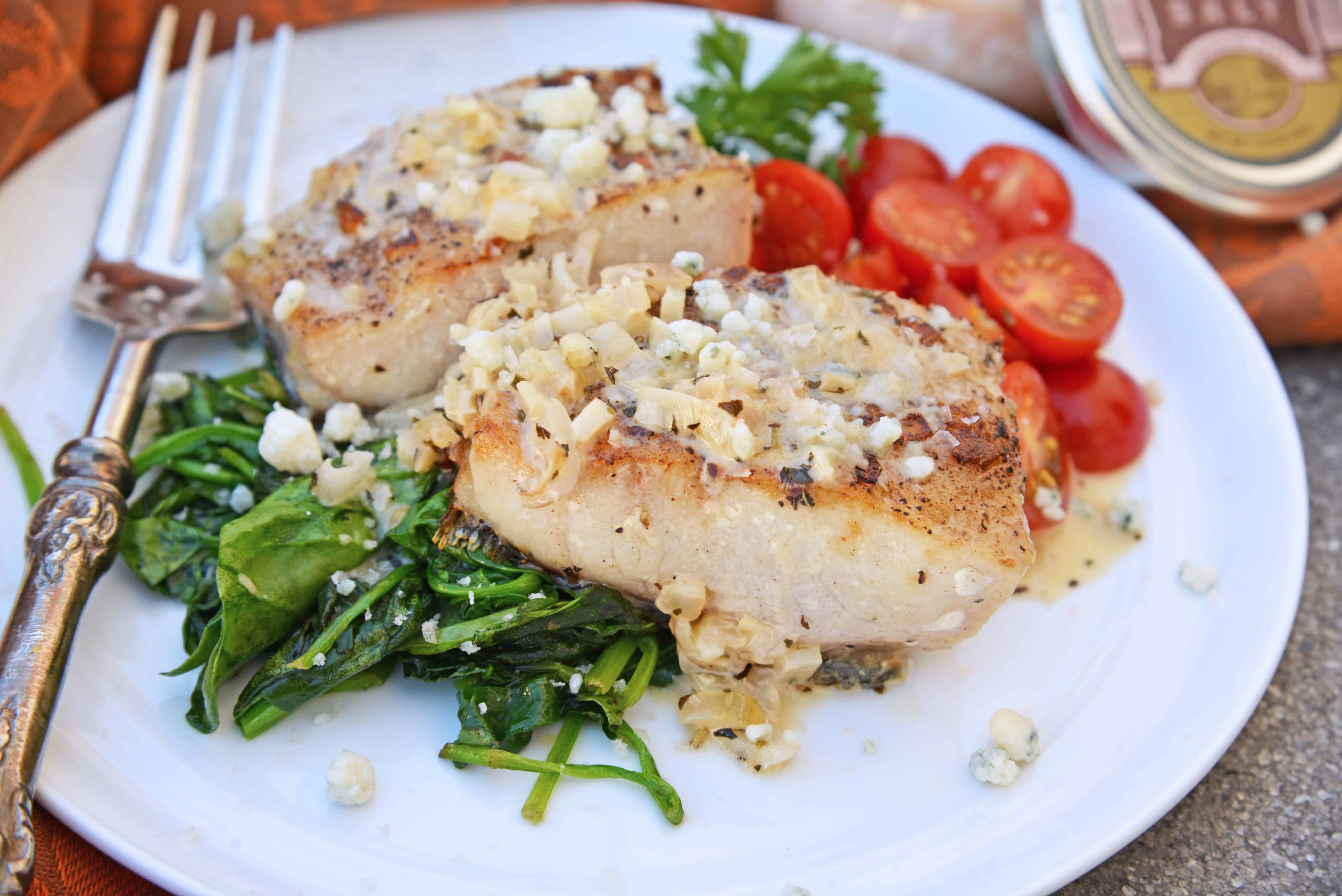 This Garlic Peppercorn Crusted Mahi Mahi recipe is serve with a sherry blue cheese cream sauce give it a restaurant quality flavor. #mahimahirecipes #howtocookmahimahi www.savoryexperiments.com