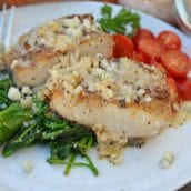 This Garlic Peppercorn Crusted Mahi Mahi recipe is serve with a sherry blue cheese cream sauce give it a restaurant quality flavor. #mahimahirecipes #howtocookmahimahi www.savoryexperiments.com