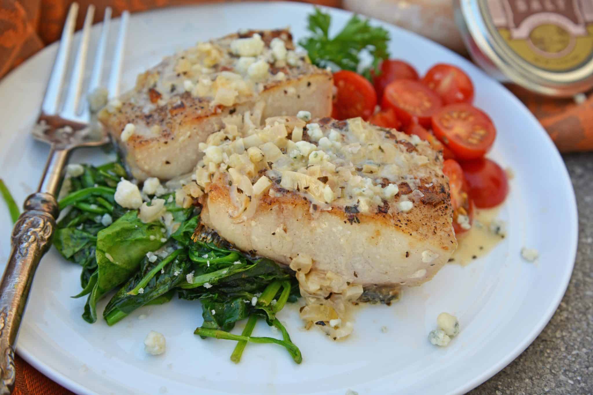 This Garlic Peppercorn Crusted Mahi Mahi recipe is serve with a sherry blue cheese cream sauce give it a restaurant quality flavor. #mahimahirecipes #howtocookmahimahi www.savoryexperiments.com